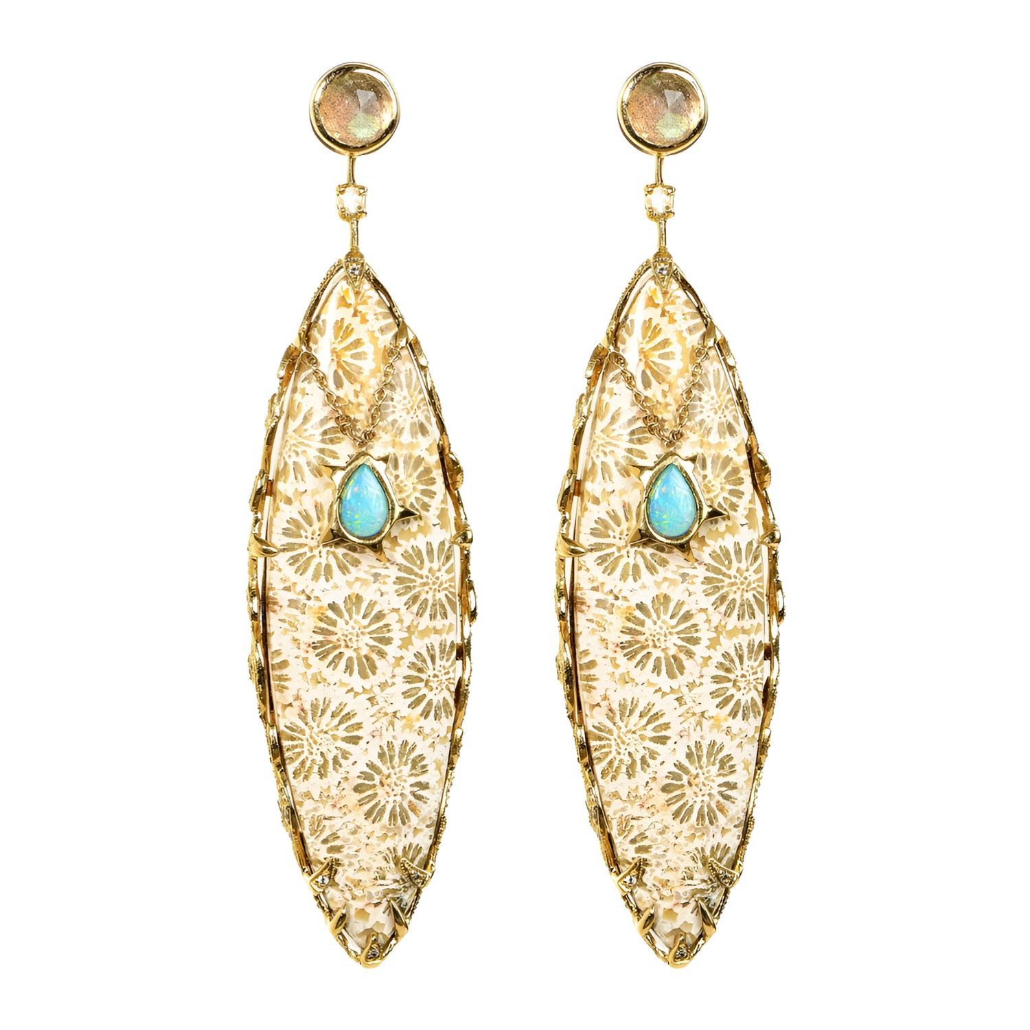 These stunning Ba Li Earrings are not only one of a kind but spectacular specimens of nature showcasing over 65 carats of fossilized coral from Bali. The ancient Petoskey coral exhibits intricate patterns that encapsulate millions of years of Earth's history. Adding to the beauty is opal (.45cts) and moonstone accents, surrounded by hand-carved 18k yellow gold leaves accented with (.44cts) of sparkling diamonds. The studs are adorned with radiant rose-cut labradorites (1.68cts) and secured with post backing