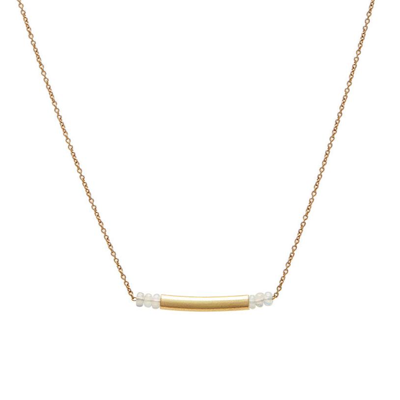 Embodying the art of simplicity, the Qi Necklace blends serene opal beads with the understated beauty of a matte 18k elongated vessel. Set on a delicate 18k gold chain, with an adjustable length of length 16-17", this piece offers a subtle yet refined elegance, perfect for every day.&nbsp;