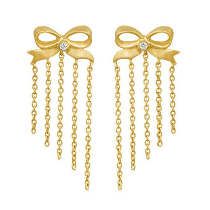 ☆ Best Seller ☆ Ingenue Bow Studs by Unhada -&nbsp;Charming and timeless, the Ingenue Bow Studs are handcrafted in 18k gold with delicate diamond accents (.05 cts). Designed with a post back for effortless wear, these versatile earrings bring a touch of refinement to your everyday style. Also available in sapphire, ruby, or tsavorite garnet—please contact us to inquire about alternate gemstone options.