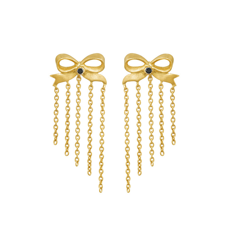 ☆ Best Seller ☆ Ingenue Bow Studs by Unhada -&nbsp;Charming and timeless, the Ingenue Bow Studs are handcrafted in 18k gold with delicate diamond accents (.05 cts). Designed with a post back for effortless wear, these versatile earrings bring a touch of refinement to your everyday style. Also available in sapphire, ruby, or tsavorite garnet—please contact us to inquire about alternate gemstone options.